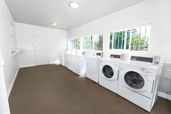 Willow manor laundry room with a washer and dryer in it.